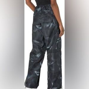 Adidas BLACK CITY ESCAPE TRACK TROUSERS IN BLACK/MULTICOLOr new with tags.